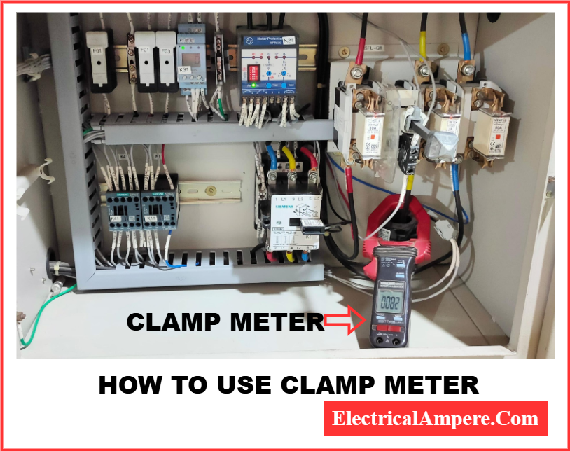 Electrician measuring current in a live circuit using a tong tester without breaking the wire